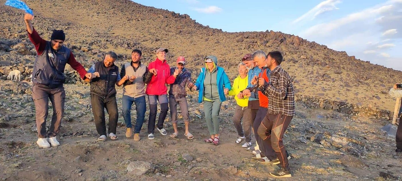 Climbers dancing the halay at camp